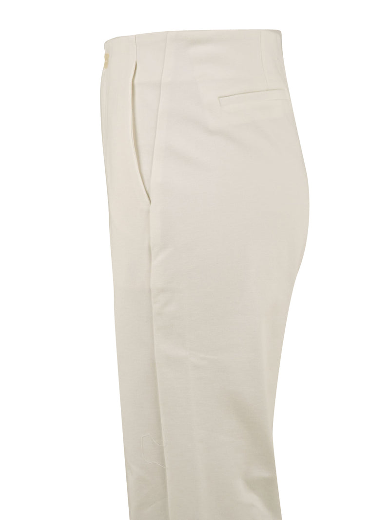 Immagine laterale del pantalone in bianco da donna firmato European Culture a vita alta e tasche a filo.